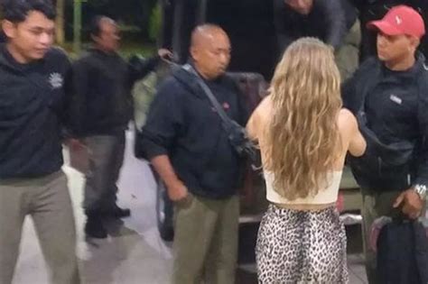 German female tourist arrested after stripping naked and。